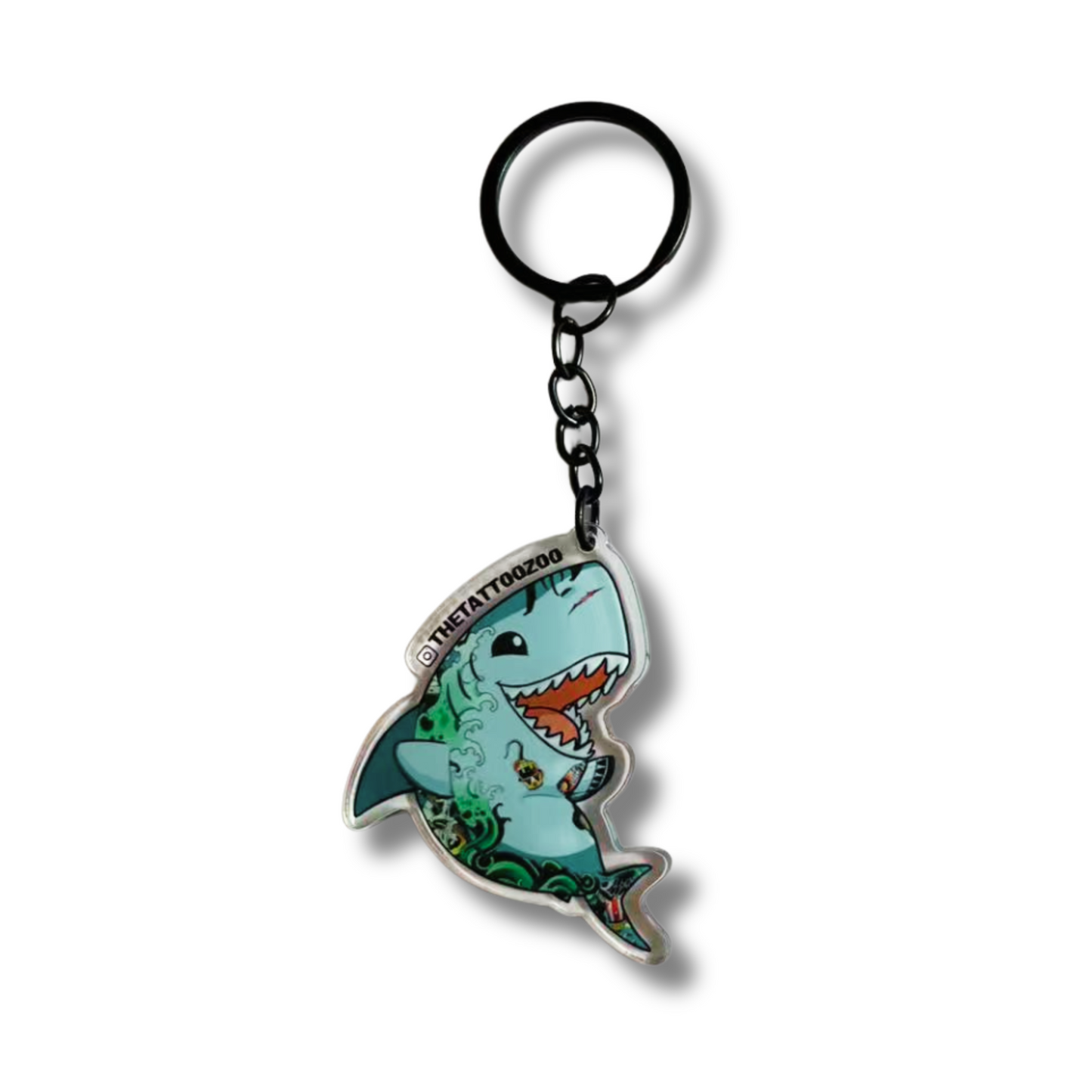 Acrylic hark-shaped keychain with a tattoo design on a white background, with a black pendant clip.