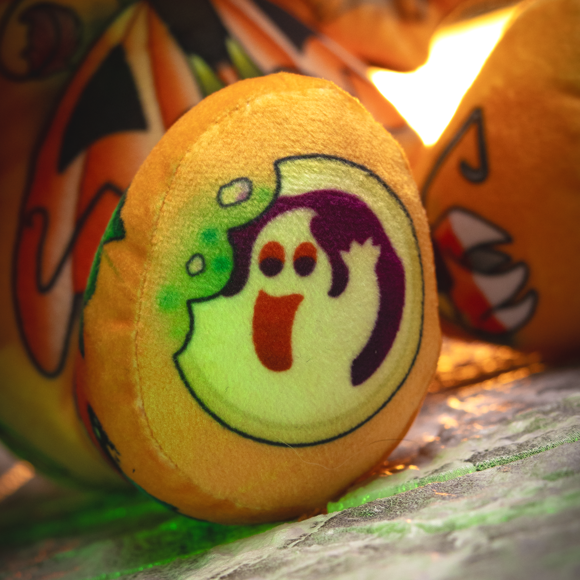 Plush toy with ghost design on a colorful background