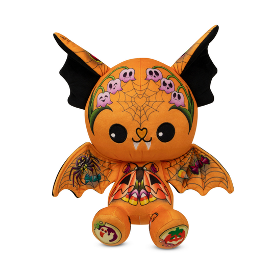 Halloween-themed plush toy with orange body, black wings, and decorative elements on a white background