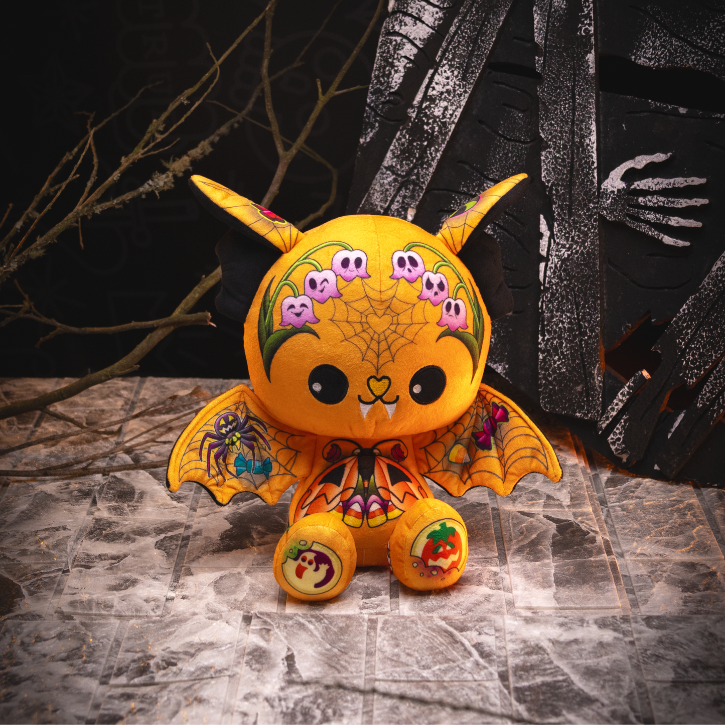 Halloween themed orange bat plushie.